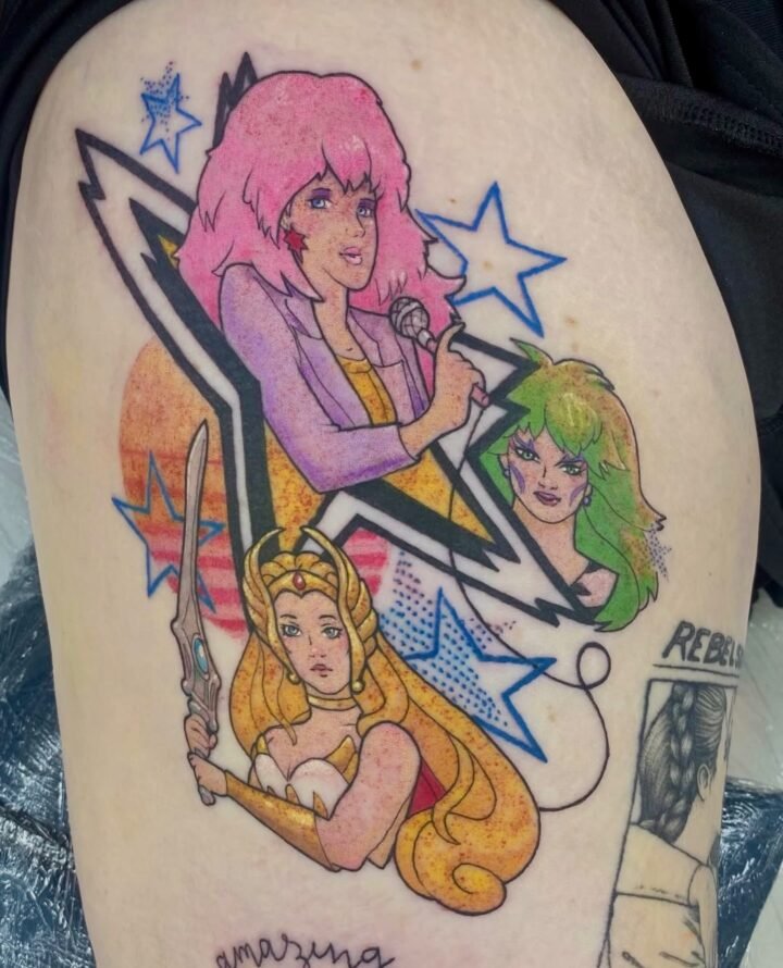 Super fun colourful Jem and the Holograms and She-Ra  tattoo Jorgi whipped up  
…
