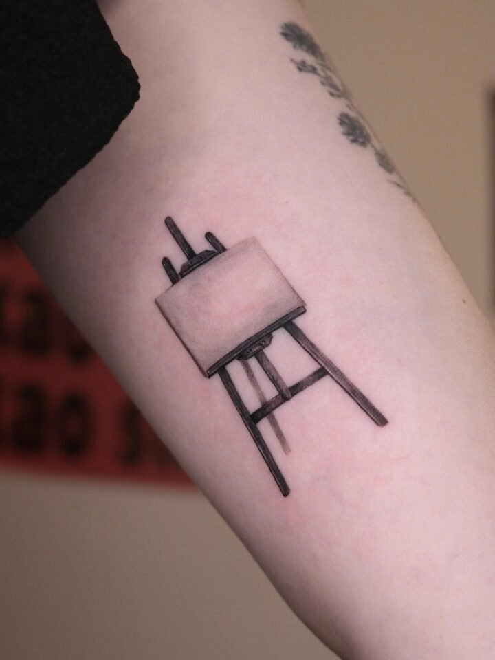 Easel tattoo 
Custom designs are available just for you 

𝙱𝚘𝚘𝚔𝚒𝚗𝚐𝚜 – 𝙳𝙼…