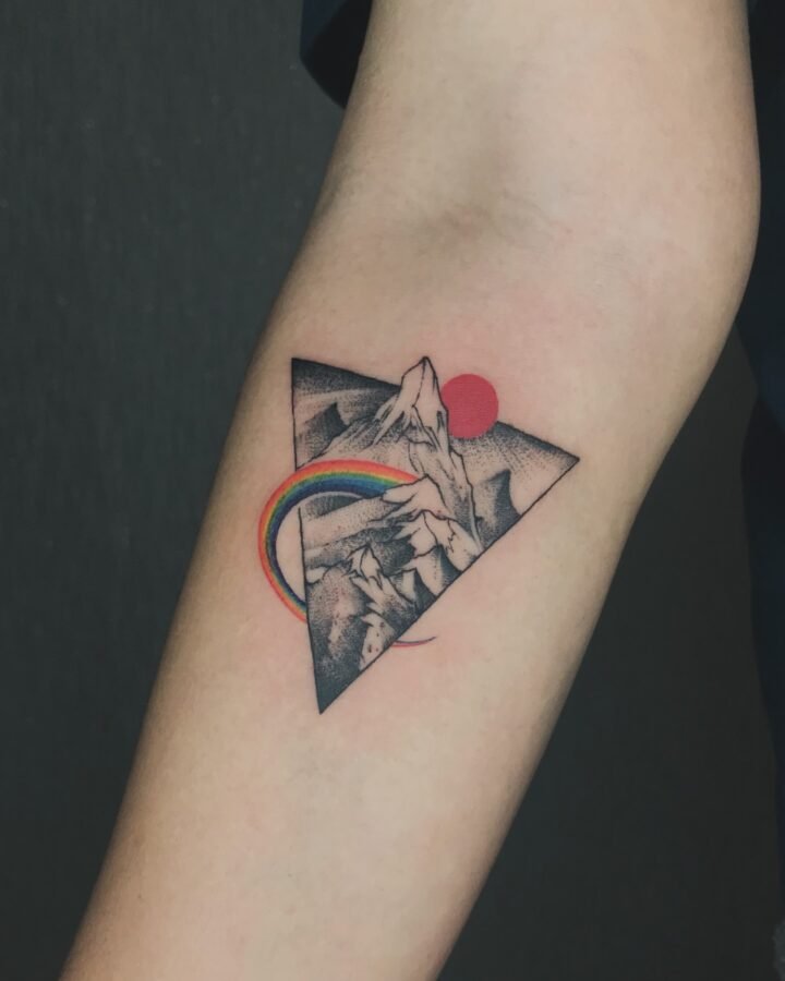 A tattoo design that blends geometric forms with surreal natural landscapes,
exp…