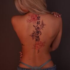 Lotus, spider lily and Chinese characters doing down the back. With water/ smoke…