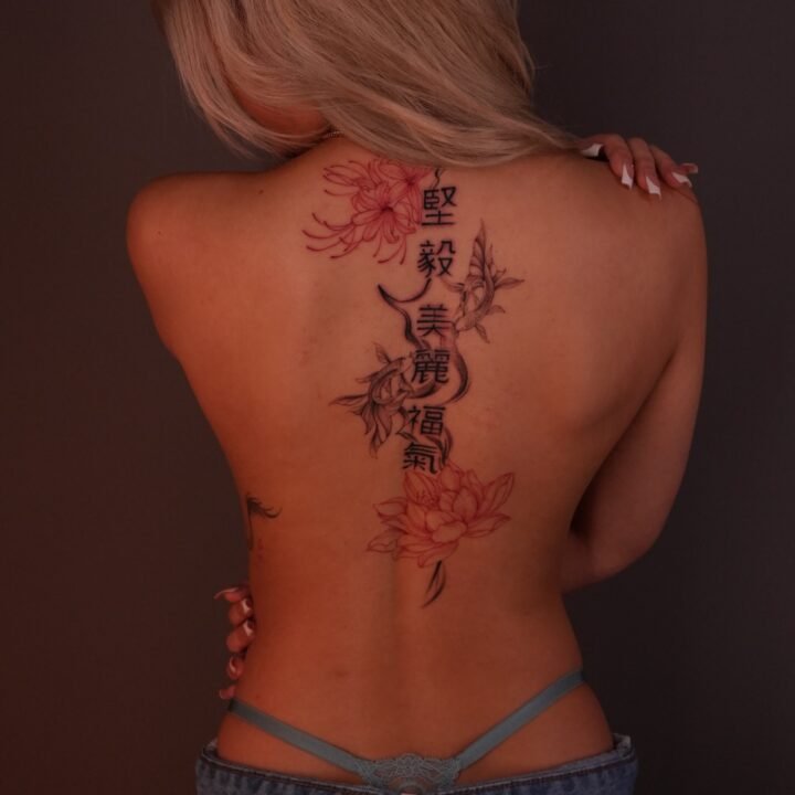 Lotus, spider lily and Chinese characters doing down the back. With water/ smoke…